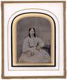 Sixth plate English ambrotype of a young woman holding a bunch of yellow flowers