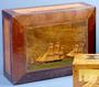 A mahogany Trinity House box with a lighthouse scene on the lid