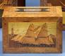 A wood still band in box form by Trinity House with a sailing vessel on front