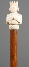 Carved ivory topped cane or walking stick with malacca shaft, bust of a queen mounted to malacca shaft, likely France