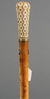 Ivory pique handled walking stick, classical form handle with vertical zigzag lines of pique offset with zigzag incising, malacca shaft, English