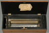 LeCoultre cylinder music box, lever wind playing eight airs with tune sheet, stripped walnut case with boxwood stringing