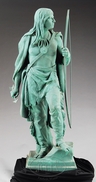 A 19th century zinc statue of an Indian Warrior with bare feet standing on a rock