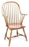 A continuous-arm bow-back windsor chair with nine spindles and bamboo turnings