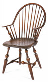 An American continuous-arm bow-back Windsor arm chair having baluster turnings