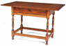 A Queen Anne pine and maple tavern table having a breadboard top, one drawer, block and baluster-turned legs, box stretcher and button feet