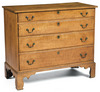 A New England tiger or curly maple four-drawer Chippendale chest of drawers