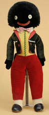 An English velveteen Golliwogg with button? eyes, possibly Merrythought, costumed in velvet and polished cotton