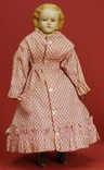 An American Autoperipatetikos or Walking Doll having a blonde Hawkins patent papier mache shoulder head, and painted and molded features with blue eyes, on a walking body with kid arms and brass clockwork mechanism with original key