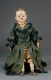 An oil-painted pressed stockinette cloth Izannah Walker girl Child doll featuring brown eyes, pink mouth and cheek coloring, brown hair with center part, and two long curls in front of applied ears