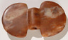 A ferruginous quartz butterfly bannerstone given the name <b>Sunset Glory</b>, collected in 1874 on a farm in Missouri