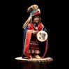 Shona-Hah carving of a shaman in eagle headdress and button blanket with a drum