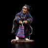 Shona-Hah carving of an elderly Nez Perce woman with a cane and a yarn bag