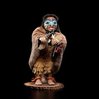 Shona-Hah carving of a shaman with a carved mask and bone necklace