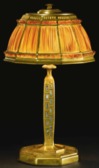 A Tiffany Studios Favrile Fabrique shade desk lamp on a signed gilt bronze and abalone shell base