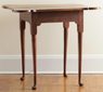 A New Hampshire Queen Anne tea table with porringer top and turned legs, maple with red stain, 1730 to 1765