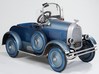 A Kissel roadster pedal car by Gendron with adjustable windshield with fly windows, front and rear license plates, simulated gear shift lever, headlights and side-mounted spare tires