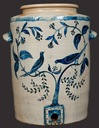Six-gallon stoneware salt-glazed pottery water cooler with profuse incised decoration of birds feeding in a flowering tree, signed