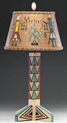 A painted wooden table lamp from the Shiprock Trading Post by Will Evans decorated with figures and geometrics