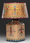 A large painted whiskey bottle table lamp from the Shiprock Trading Post by Will Evans decorated with polychrome painted thunderbird motif and geometric patterns