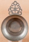 A Providence, Rhode Island pewter porringer bearing the touch of William Calder