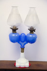 A Ripley & Co, marriage oil lamp, American, second half of 19th century. Opaque white base, brass collar, double translucent blue fonts