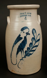 Frank Norton stoneware churn with cobalt parrot decoration, from Worcester, Massachusetts