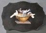 Grand Tour micromosaic-inlaid paperweight, Italy, mid-19th century, depicting Pliny's Doves inlaid to a cartouche-form black marble base