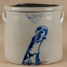 A two-gallon stoneware crock by White's, Utica, with applied handles and cobalt bird decoration