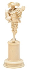 A Dieppe (France) ivory carving of a Musketeer with stein in hand, 19th century