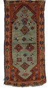 East Anatolian Yastik, late 19th century, the large soft emerald green pendanted and hooked medallion inset with hooked diamonds and other geometric details