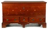 A Chippendale blanket chest with three drawers and bracket feet, walnut with decorative inlay that includes tulips and stars, dated 1818, Pennsylvania origin