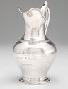 Boston coin silver presentation pitcher Boston, Massachusetts, circa 1860. A coin silver pitcher by Jones, Shreve, Brown & Co., with applied handle, a repoussed dentil molding at the shoulder