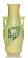 A Roseville pottery, handled, green experimental Silhouette vase with red plumeria decoration hand carved by Frank Barks, circa 1950
