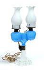A double font marriage oil lamp on milk glass base and marked D.C. Ripley Co.