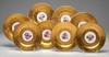 A lot of eight Bavarian porcelain, 20th century service plates featuring low-relief gold rims and a circular central reserve featuring a painted floral arrangement or bouquet