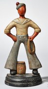 A polychrome cast iron sailor figure and cask doorstop, America, late 19th century,