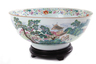 Chinese porcelain famille rose punch bowl, Qing dynasty, decorated with extensive scene of Asian life