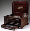 A Stella mahogany disc music box with 34 discs