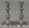 A pair of pewter candlesticks by Flagg & Homan