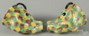 Pair of ox head porcelain stirrup cups, mottled glaze