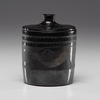 Maria Martinez (San Ildefonso, 1887-1980) lidded pottery jar, cylindrical jar with light gunmetal finish, decorated with Avanyu