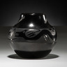 Maria (1887-1980) and Santana (1909-2002) Martinez San Ildefonso Blackware Pottery Jar, formed with a wide body and constricting neck. Avanyu winds