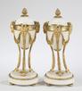 A pair of Louis XVI style ormolu and alabaster cassolettes, French, 19th century. Each with berry finial at top with acanthus leaves on domed lid, inverting to a candleholder