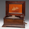 A Stella 15.5 inch disc music box in mahogany case
