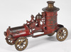 An A. C. Williams cast iron fire pumper toy truck with driver
