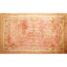 OUSHAK CARPET, orange and red field with various floral and geometric designs,