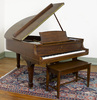 A Steinway Model L baby grand piano with bench