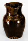 Monumental Four-Gallon Alkaline-Glazed Stoneware Pitcher, Incised