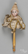 An Armand Marseille musical bisque head doll marotte